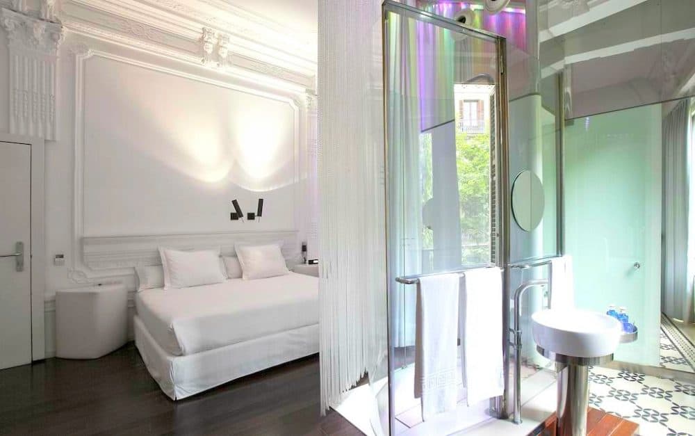 A glass shower door view at Chic at Basic Hotel in Barcelona