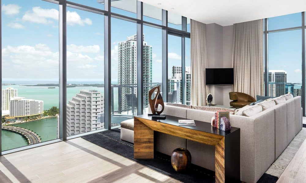 A living room filled with furniture and a large window in East Miami Instagramable hotel 