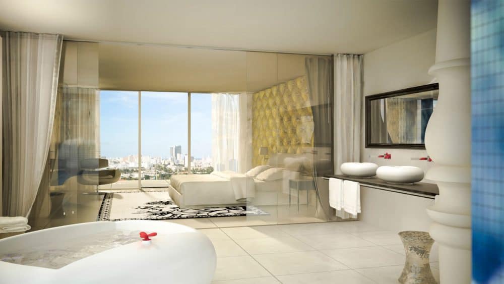 A living room filled with furniture and a large window in Mondrian South Beach hotel in Miami