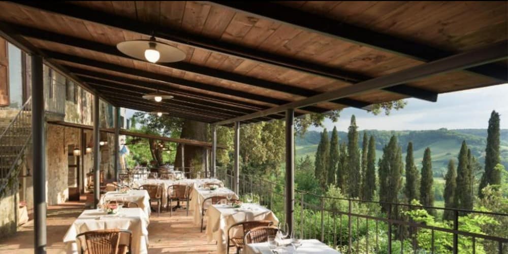 A room filled with furniture and a bridge at Laticastelli Country Relais In Tuscany
