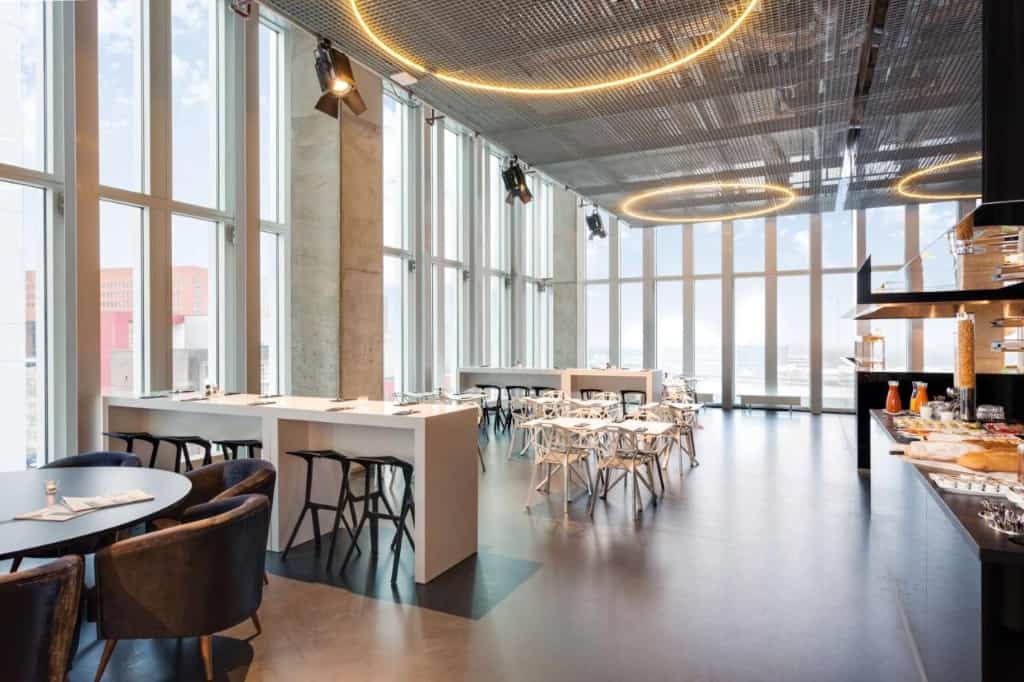 Nhow Rotterdam a trendy sleek and modern hotel featuring a roof top bar overlooking the river Maas city skyline