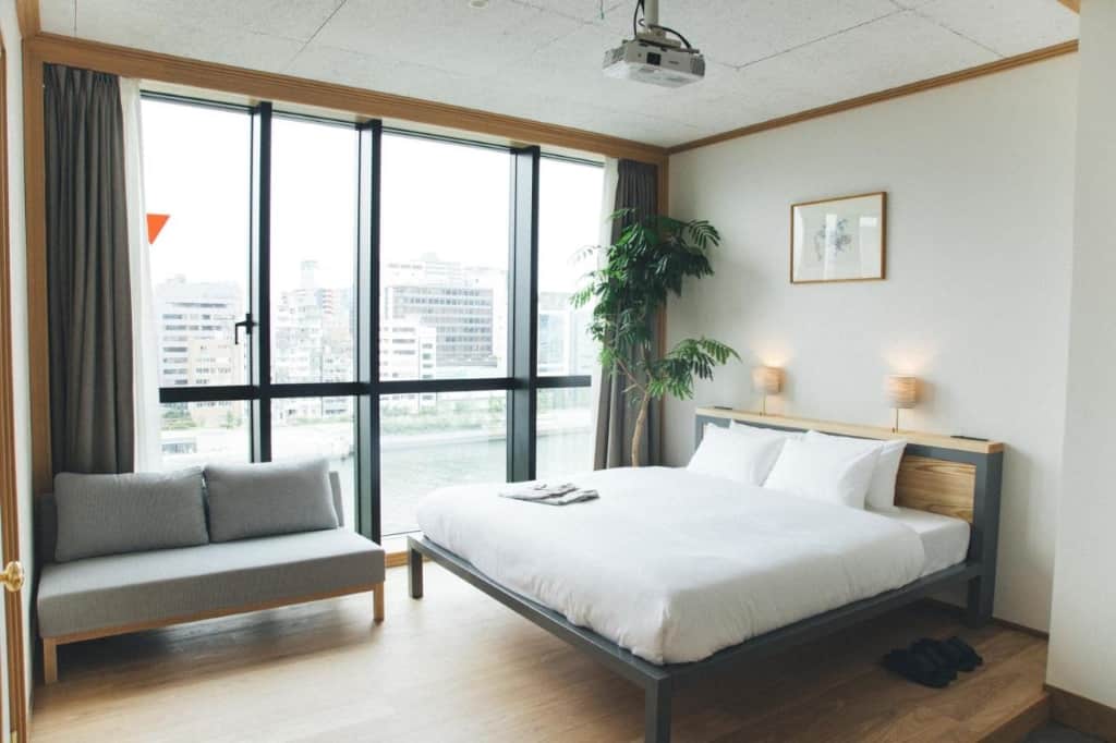 Hotel Noum OSAKA - a chic, contemporary boutique hotel located next to the green parklands and overlooking the Okawa River