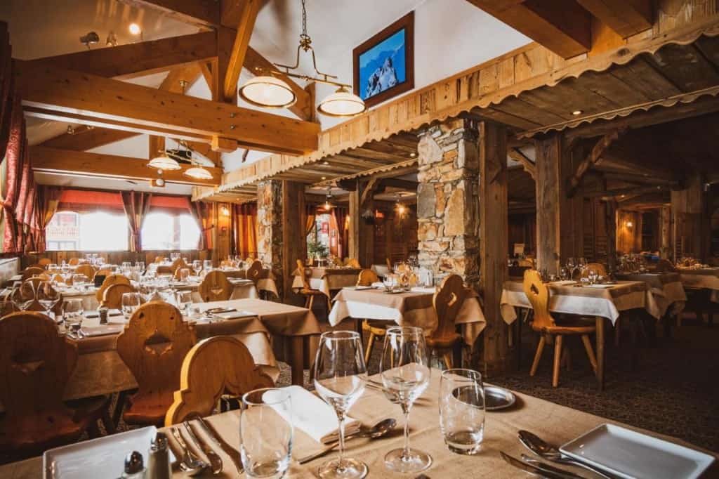Le Sherpa - a traditional, charming chalet-style hotel where guests can experience a 5-course dinner filled with gourmet delicacies 