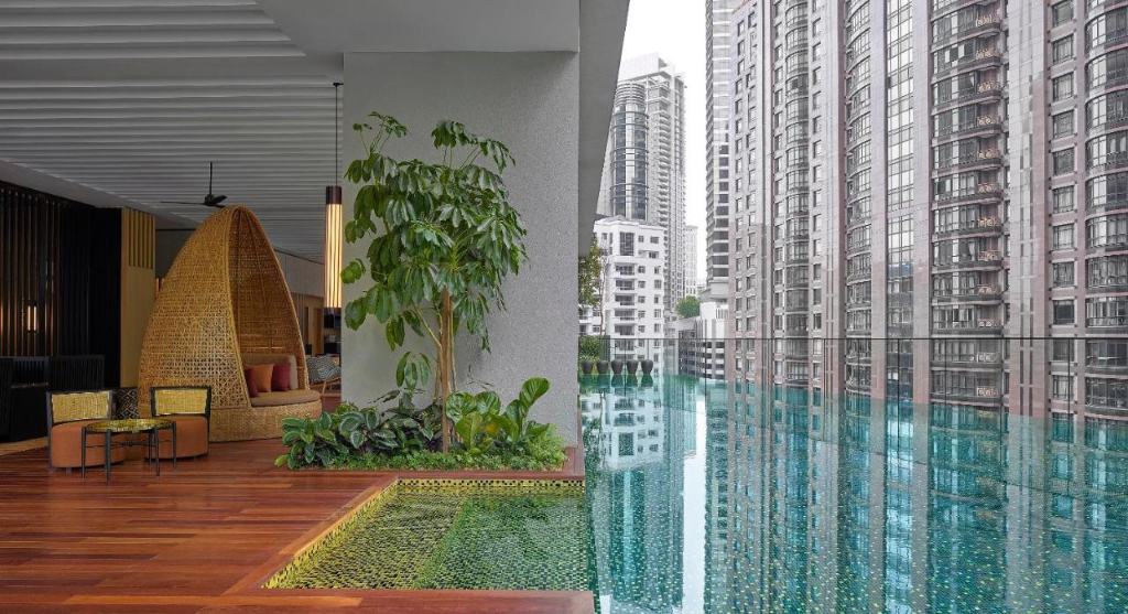 The RuMa Hotel and Residences - one of the best highest rated 5-star resorts in Kuala Lumpur offering guests a lavish, rustic-chic and rejuvenating stay